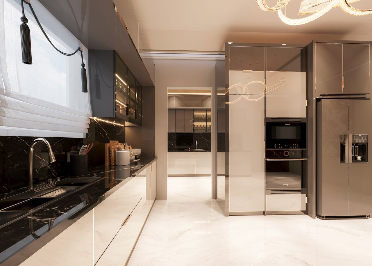 Contemporary kitchen with sleek marble countertops, modern appliances, and elegant lighting.